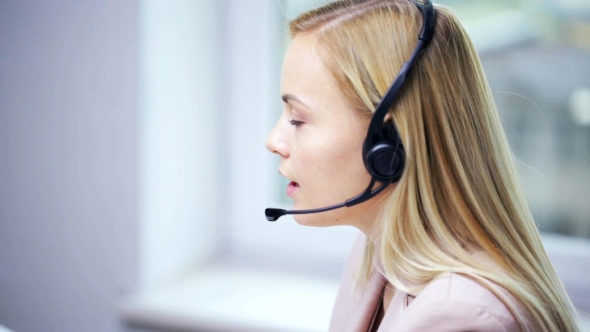 Businesswoman With Headset Talking At Office 76