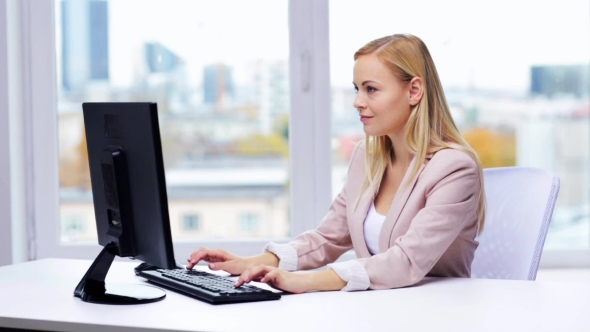 Happy Businesswoman With Computer Typing At Office 19