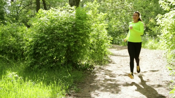 Sport Girl Runner On Forest Path In Park. Sunny Day. Stop Then Have Rest.