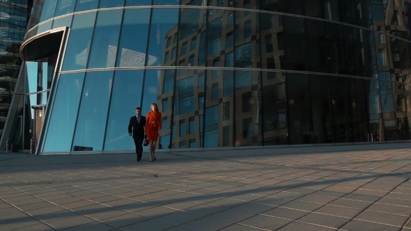 Couple Of Business People Walking Near Business Centre