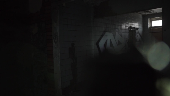 Soldier With a Gun And a Laser Sight Searching Dark Ruined Building alt