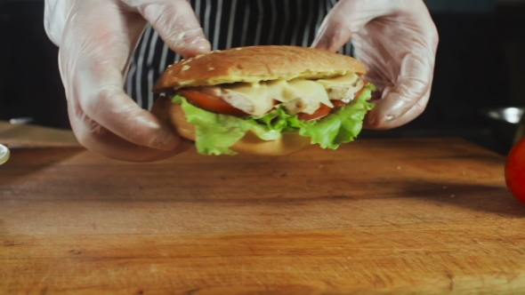 Chef Turns A Sandwich To Wooden Board