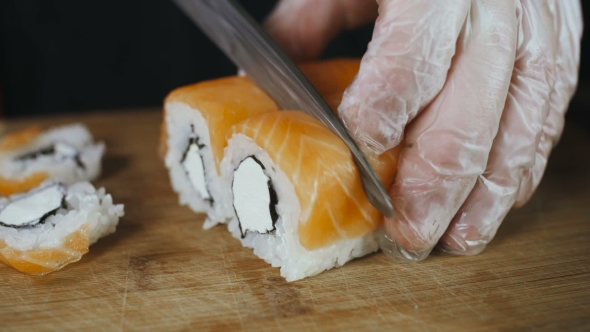 Knife Cuts Salmon Sushi