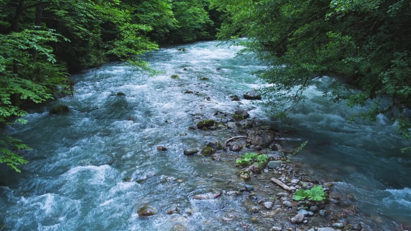 The Mountain River With Blue Water