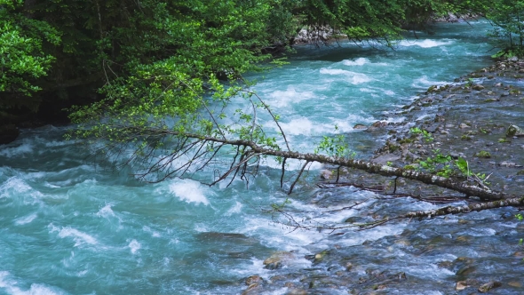 The Mountain River With Blue Water