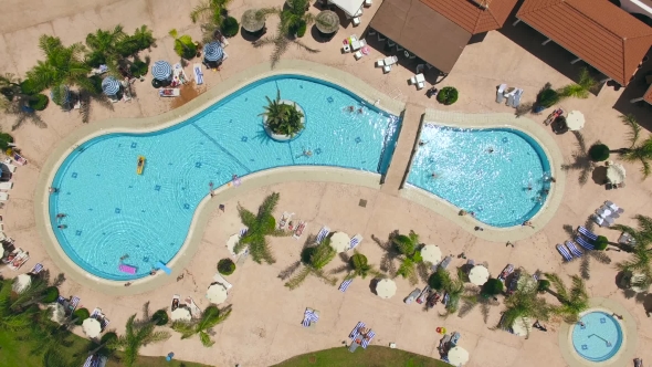 Aerial View Of Swimminig Pool With Vacationers