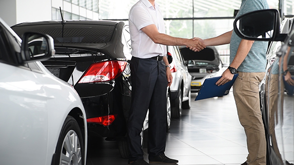 Car selling in showroom