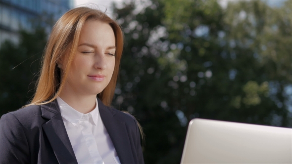 Portrait Of Beautiful Business Woman Using Laptop PC Outside Business Center