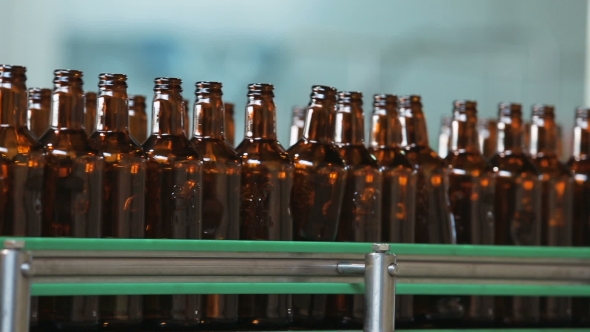 Dark Glass Bottles On The Conveyor