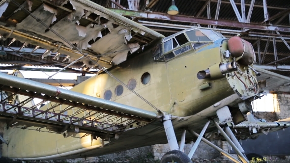 Old Military Airplane In The Hangar