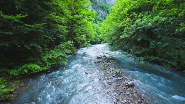 The Mountain River With Blue Water