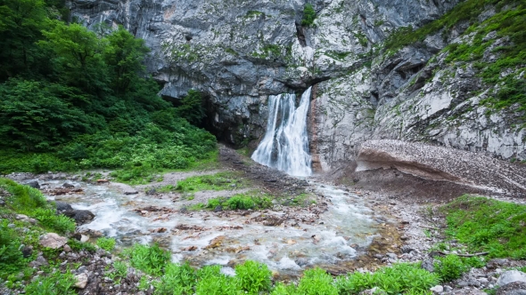 Waterfall In The Mountains