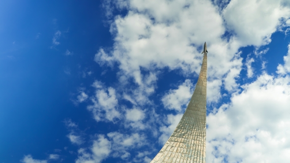 Steel Space Rocket Monument In Moscow Against Cloudy Sky  