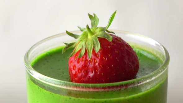 Rotating Green Pannacotta Dessert With Strawberry   Video