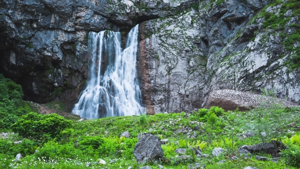 Waterfall In The Mountains