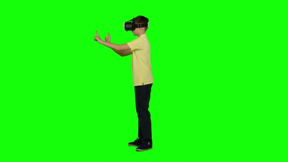 Virtual Reality Mask. Ghild Uses Head-mounted Display. Green Screen