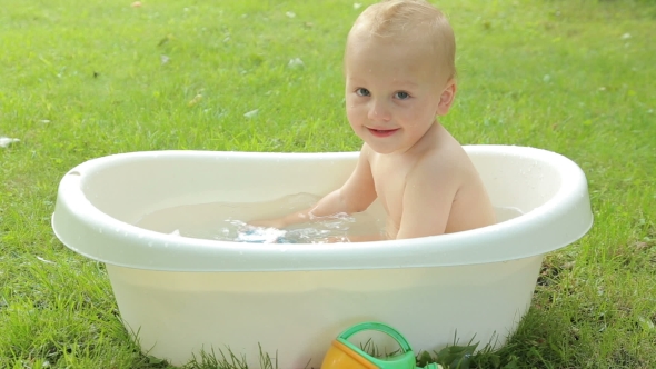 Baby Has Fun Bathing Outdoor