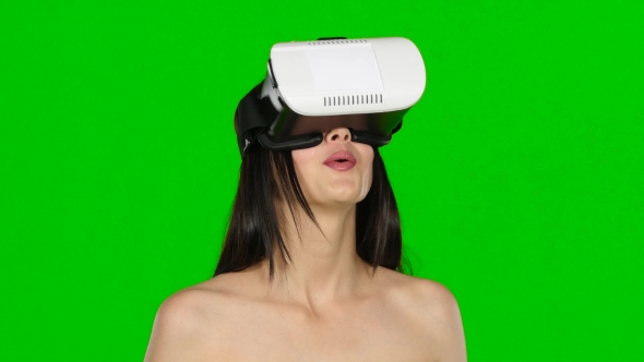 Woman Using Virtual Reality Headset, VR Mask, . Green Screen