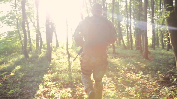 Military Goes In The Forest And Looks Back
