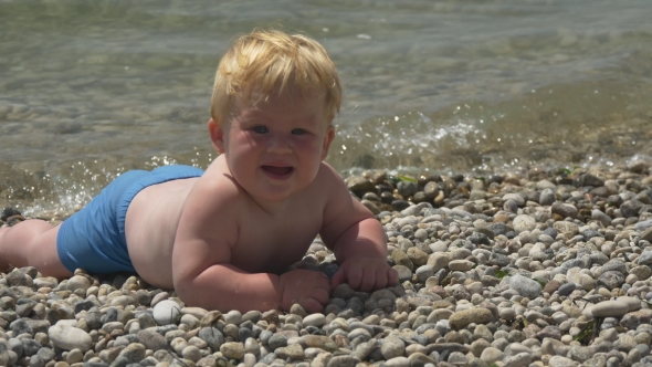 Happy Little Boy On The Seashore