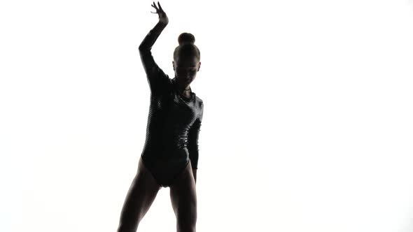 Dancer Silhouette in a White Studio