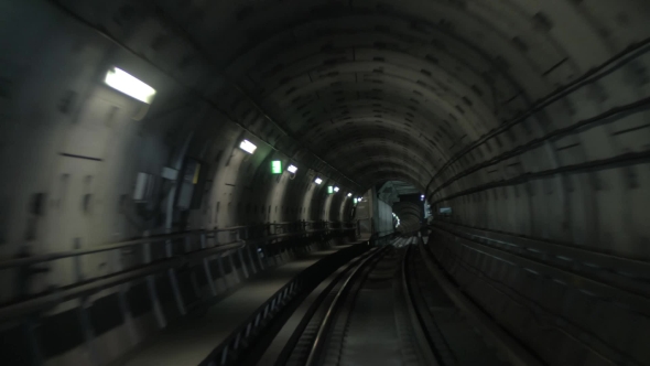 Train Making His Way In Dark Underground Tunnel