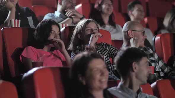 Two Teen Girls Laughing Nonstop During Funny Movie