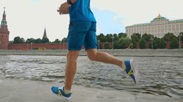 Athletic Man Runner Against Moscow Kremlin