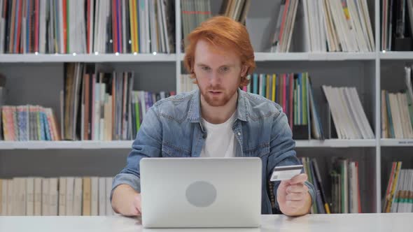Successful Online Payment By Redhead Man in Office