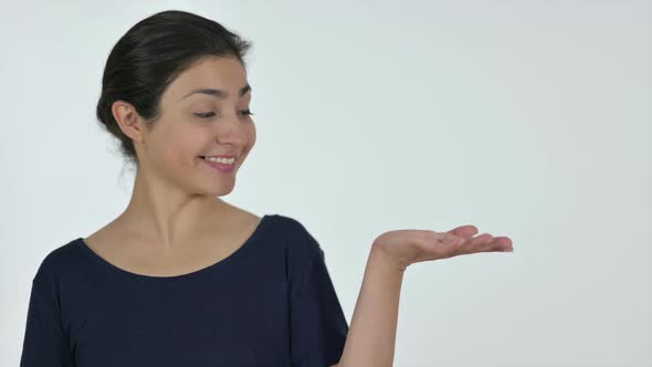 Indian Woman Holding Product on Palm White Background