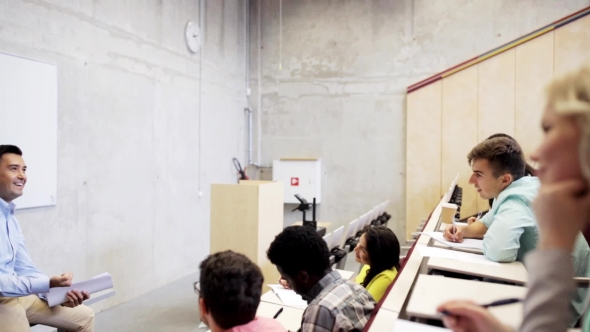 Group Of Students And Teacher Talking On Lecture