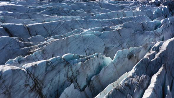 Closeup of glacier landscape in Iceland with deep crevasses and patterns. 4K