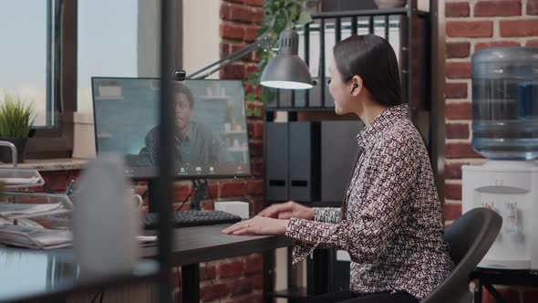 Business Woman Using Video Call to Talk to Colleague