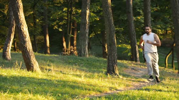 Sportsman Goes Jogging in Forest