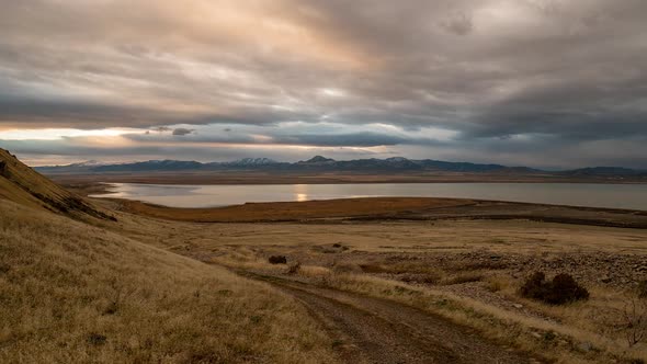 Road winding through the landscape during time lapse at dusk