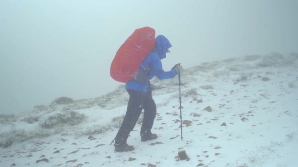 rocky alpine peaks, landscape of a slovakian tatra mountains, woman or female hiker hiking with back