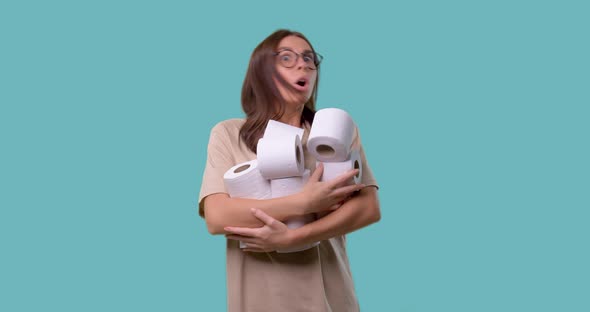 Cute Woman Holds Bunch of Rolls with Toilet Paper, She Opened Her Mouth in a Surprise