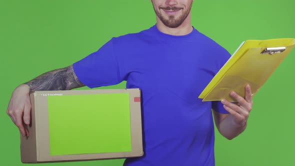 Cropped Shot of a Deliveryman Holding Copyspace Cardboard Box and Clipboard
