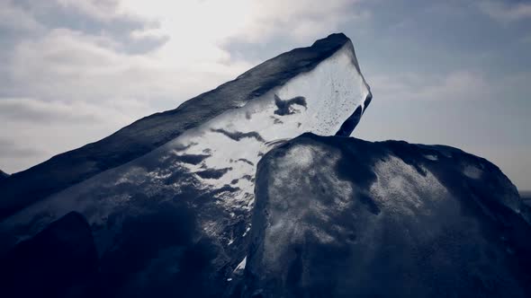 Clear and Transparent Ice Block on Seacoast Closeup View Winter Time in North