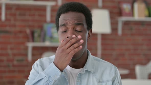 Portrait of Yawning Tired African Man