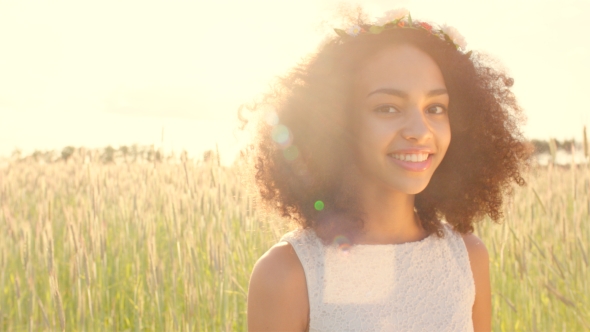  Of Young Girl Wearing Flower Wreath In Sunset