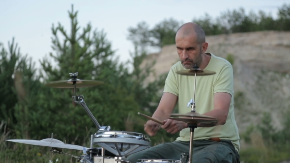 Man Playing Drums on Nature