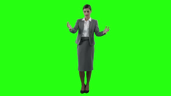 Businesswoman gesturing on green screen