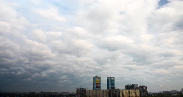 Thick Clouds Above City Buildings