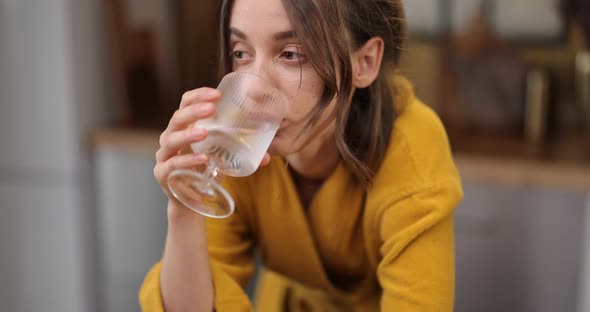 Woman Drinks Water in the Morning