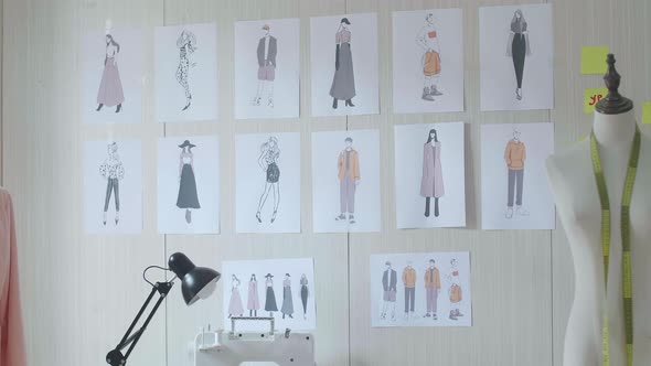 Clothes Drawing Pictures Being Sticked On The Wall In The Designer Studio