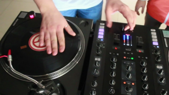 DJ Spinning, Mixing, And Scratching.
