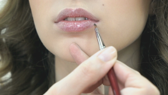 Makeup Artist Making Make-up For a Stylish Girl