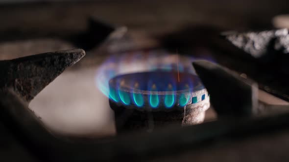 Closeup of Gas Burning in a Gas Cooker in the Dark