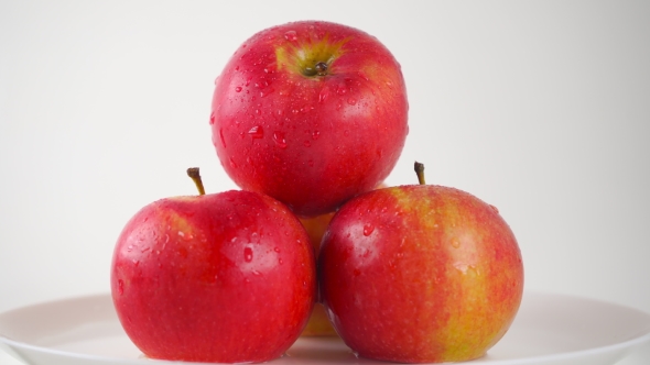 Girl Hand Taking One Wet Red Apple